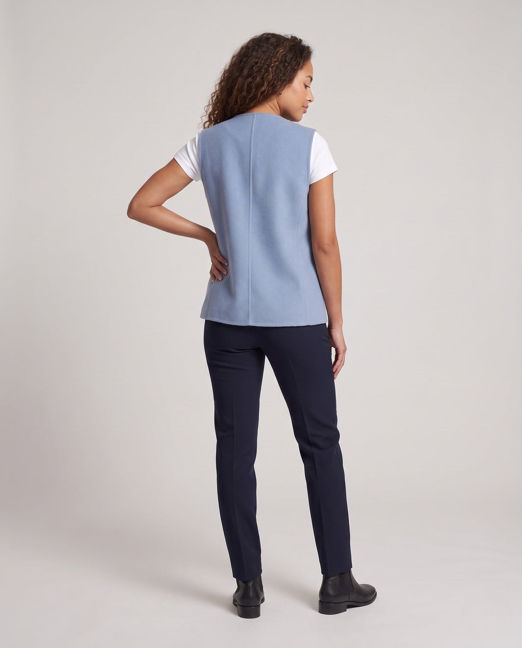 Gilet croisé sans manches en mélange de laine pour femme, avec poches plaquées et bas arrondi