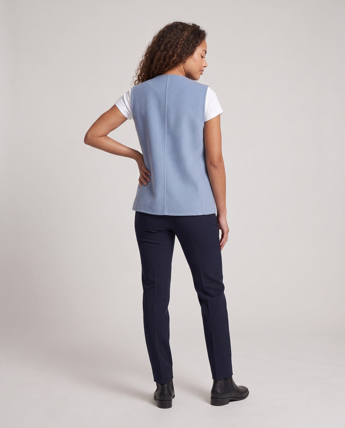 Gilet croisé sans manches en mélange de laine pour femme, avec poches plaquées et bas arrondi