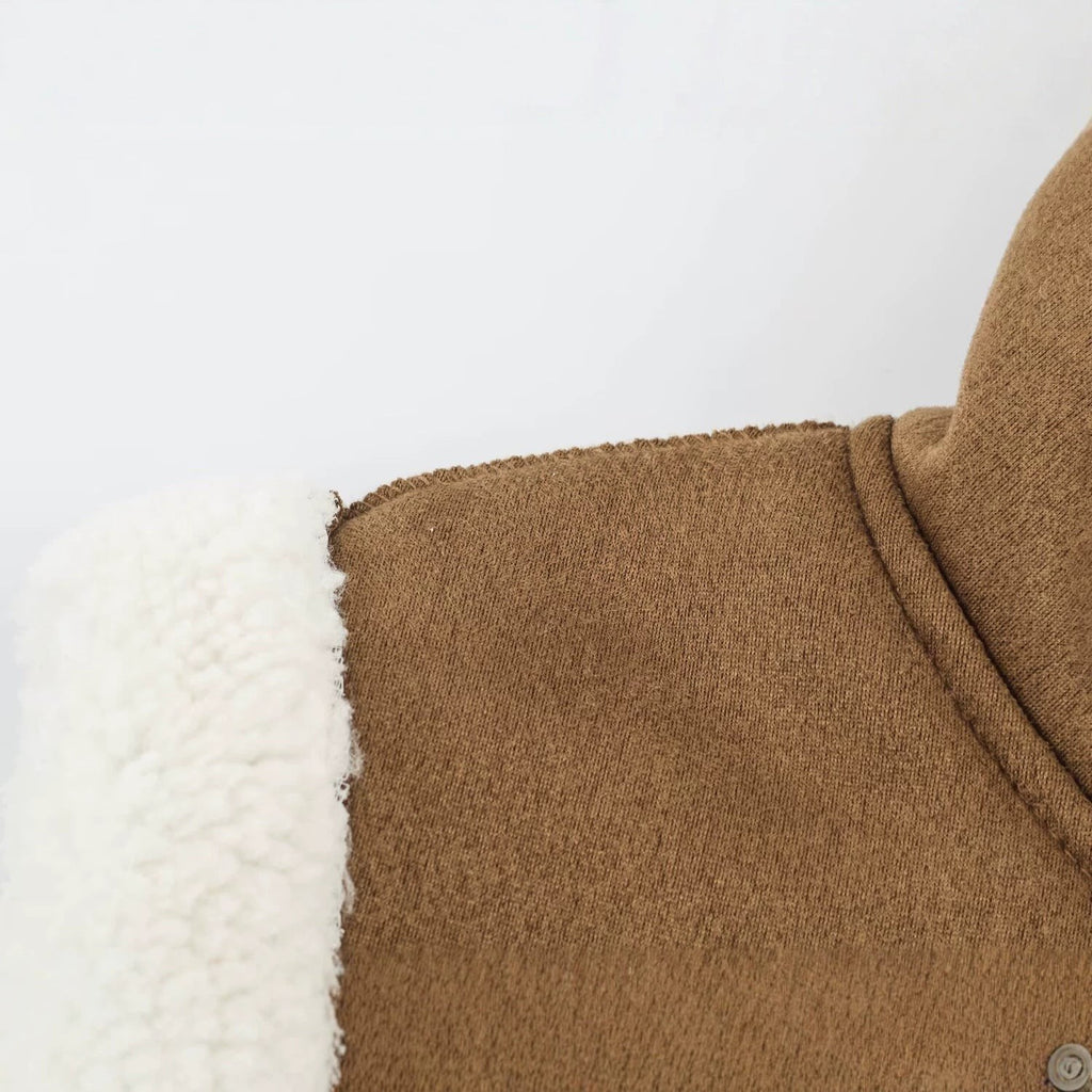 Gilet sans manches en peau de mouton pour femme, col montant et fermetures à olives