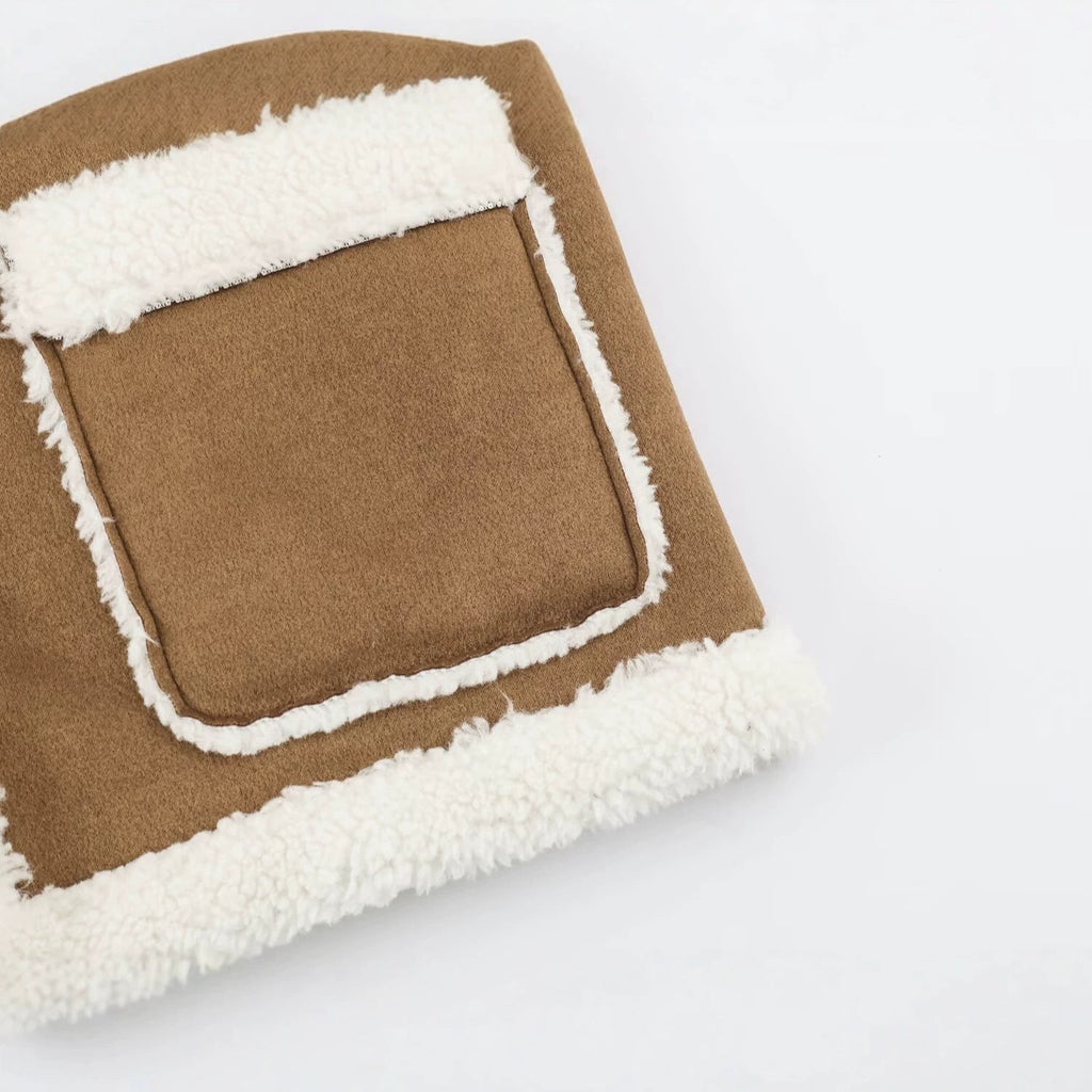 Gilet sans manches en peau de mouton pour femme, col montant et fermetures à olives